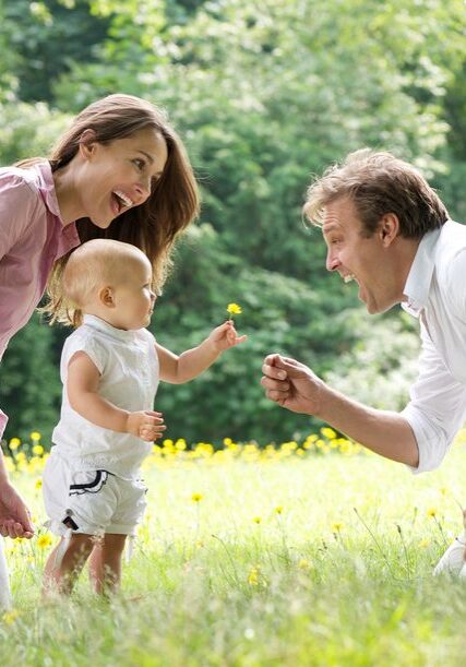 happy-family-toddler-walking-dreamstime_s_32549821